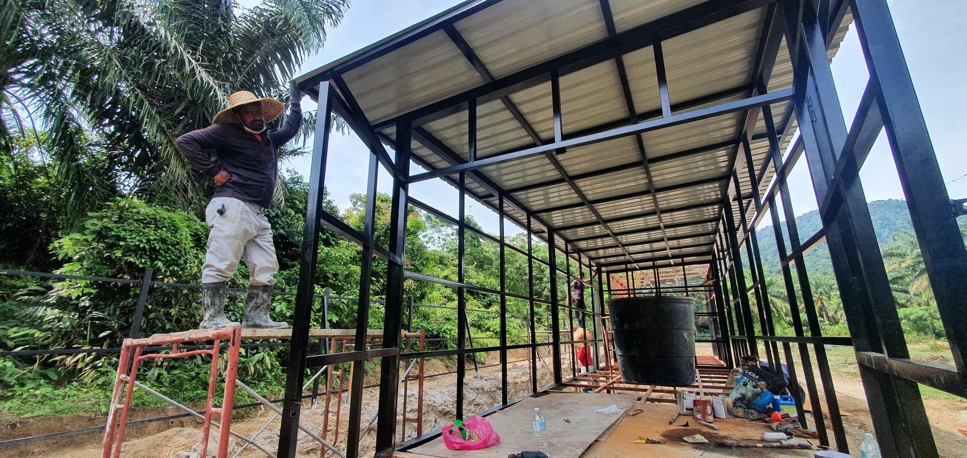 Roof sheets going on over the steel frame